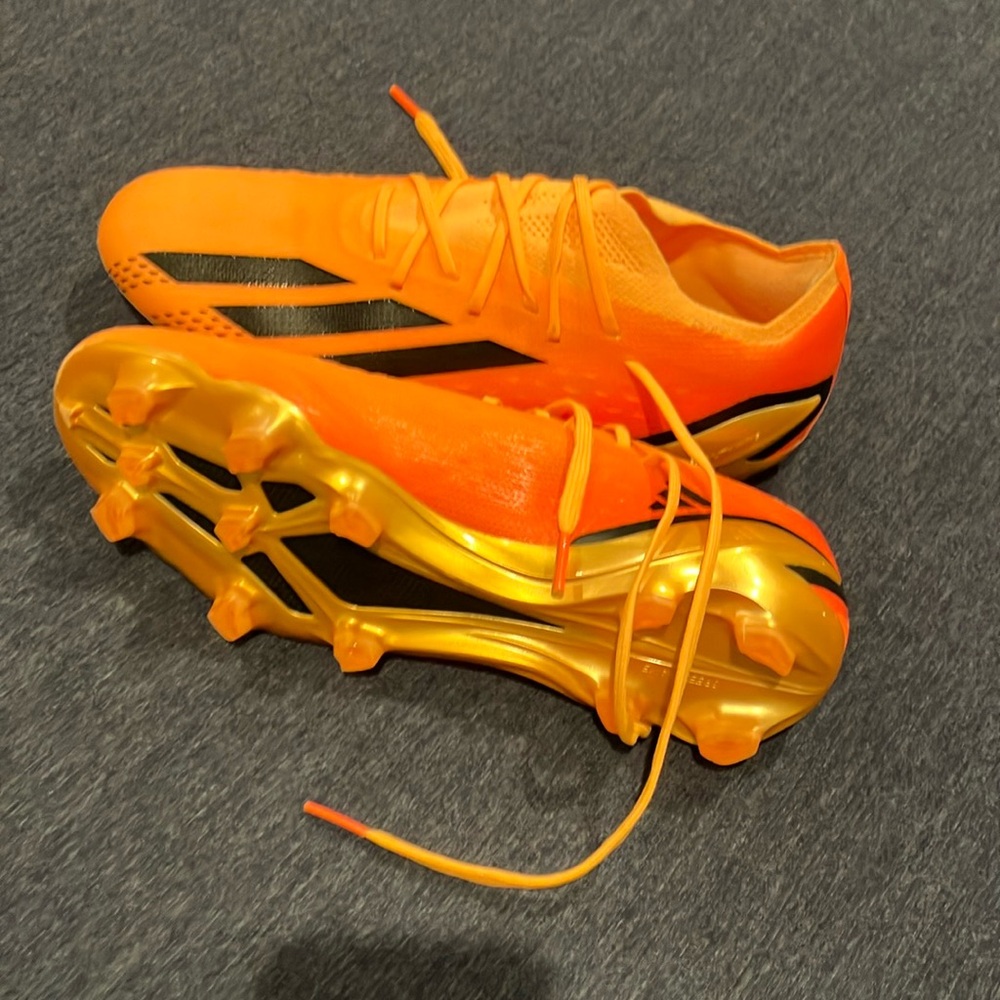 Orange, gold, and black adidas crazy fast elite soccer shoes